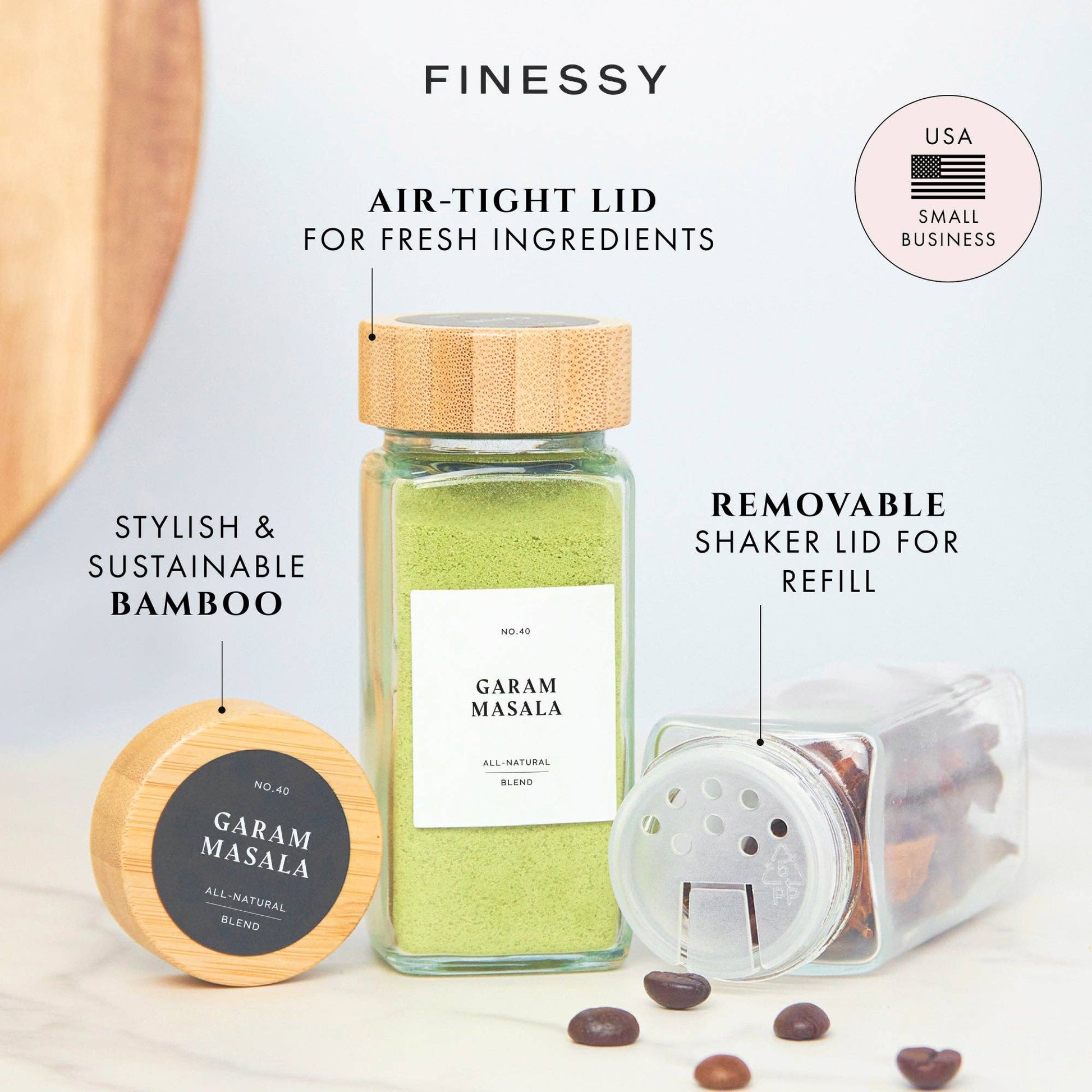 Garam Masala jar with bamboo lid and transparent refillable container on a light background