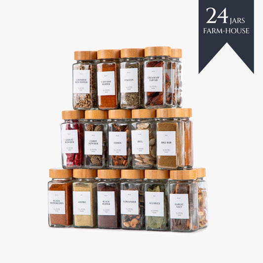 Stack of 24 glass spice jars with wooden lids on a white background, featuring the '24 Jars Farm-House' brand.